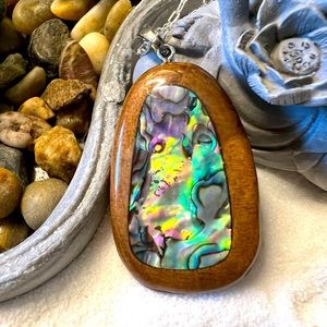 Gorgeous carved wood pendant with abalone shell inlay and silver chain